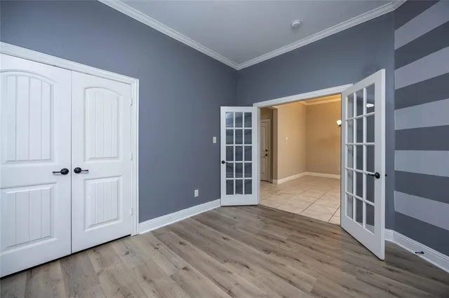 wooden floor and closet in a room