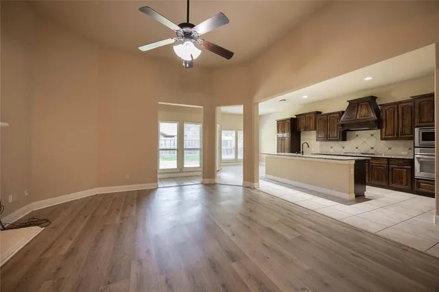 a view of kitchen with cabinets and wooden floor