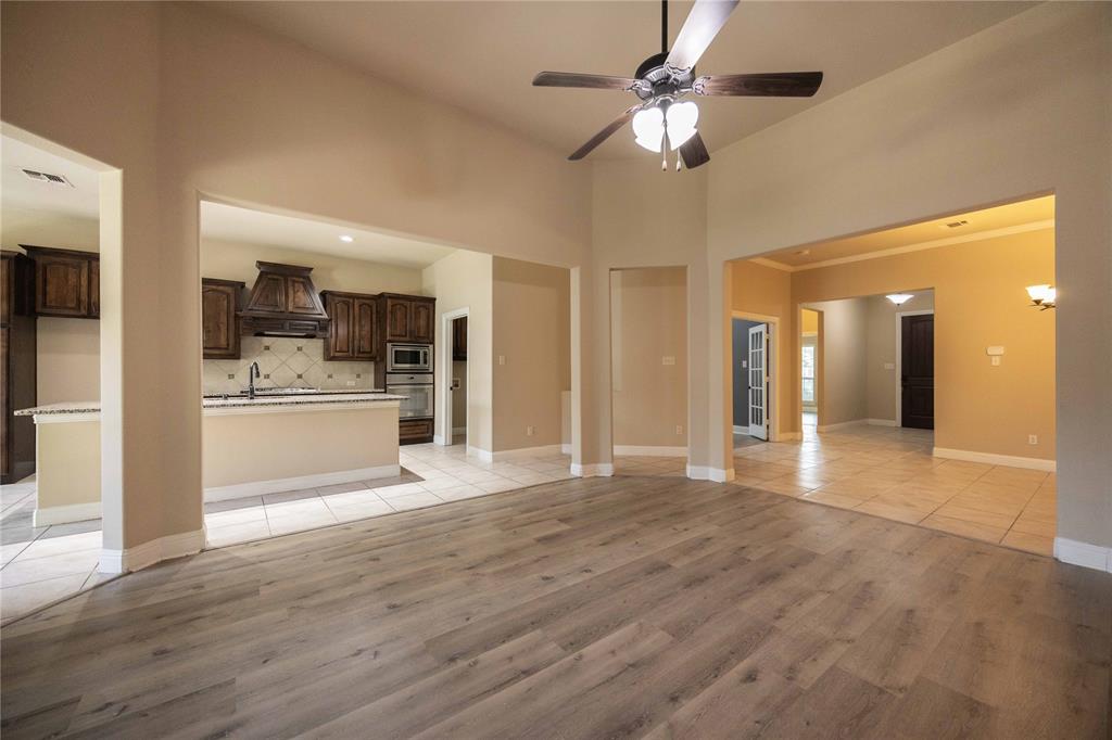 10500 Musketball Place McKinney, TX 75072 - Photo 10 of 40 a view of a kitchen with a sink and a refrigerator