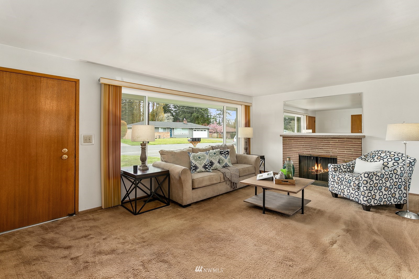 11420 Southeast 182nd Street Renton, WA 98055 - Photo 2 of 23 a living room with furniture and a fireplace