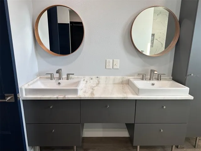 a bathroom with a sink and a mirror