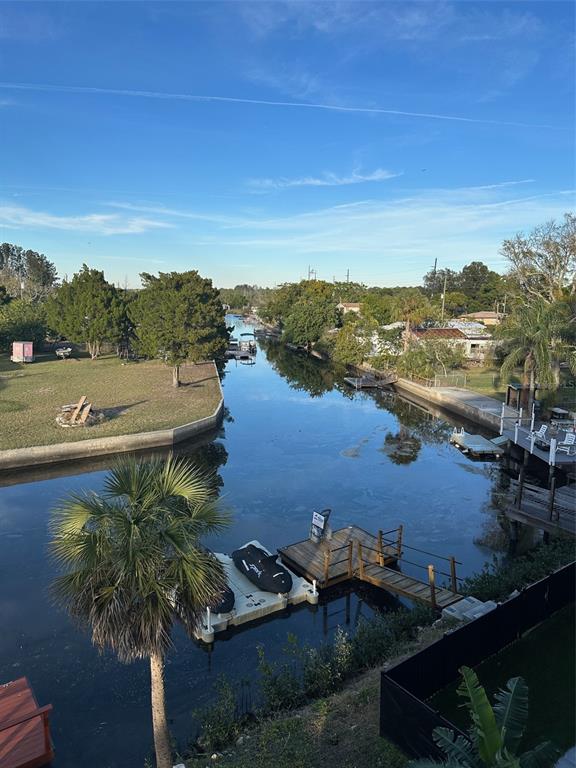 7119 Fair Lane Hudson, FL 34667 - Photo 23 of 32 an aerial view of ocean and residential houses with outdoor space
