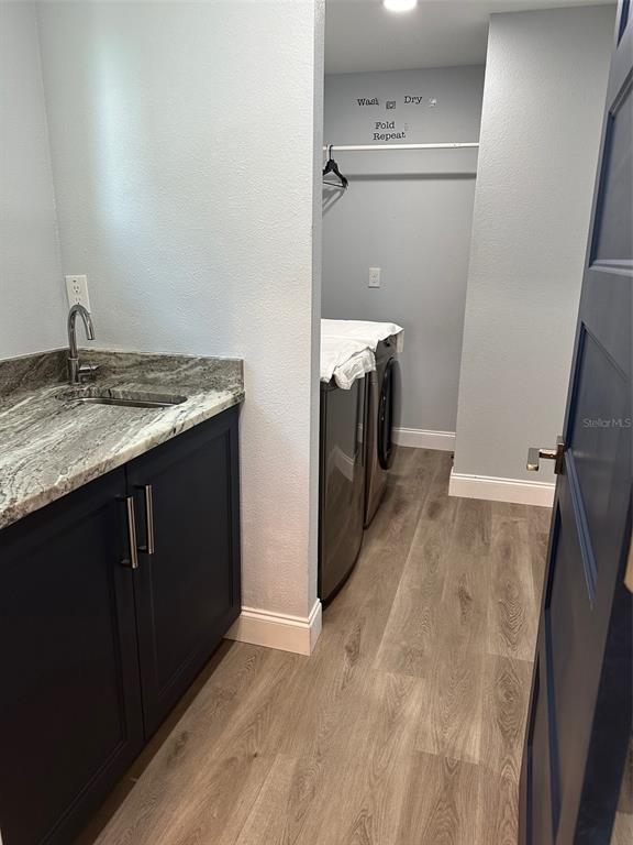 7119 Fair Lane Hudson, FL 34667 - Photo 9 of 32 a kitchen with a sink and a mirror