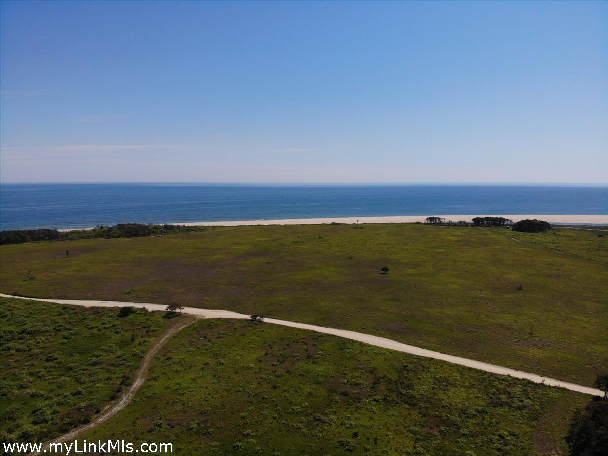 0 Pocha Road Extension Edgartown, MA 02539 - Photo 8 of 8 a view of an ocean and beach