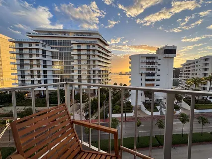 a view of a balcony with two chairs
