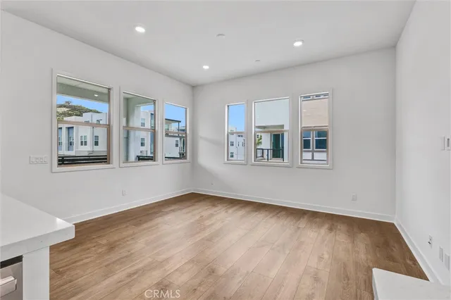 a kitchen with kitchen island stainless steel appliances a sink and a refrigerator