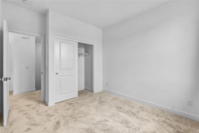 a bathroom with a toilet and a bath tub