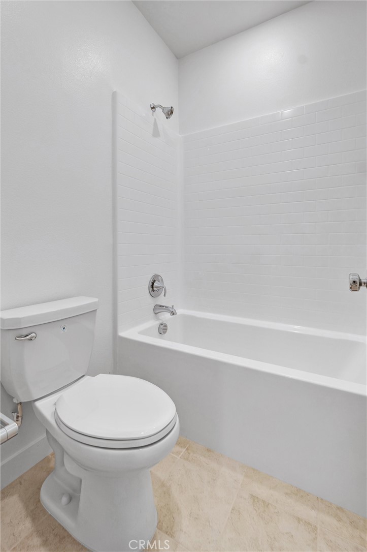 1808 Hollyleaf Terrace Montebello, CA 90640 - Photo 23 of 56 a bathroom with a toilet and a bath tub
