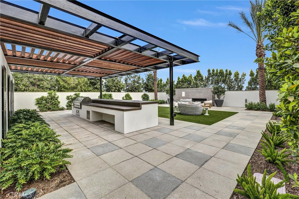 1808 Hollyleaf Terrace Montebello, CA 90640 - Photo 41 of 56 a patio view with a table and chairs under an umbrella