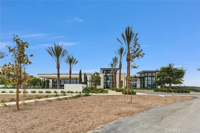 a view of a dining room with furniture large windows and wooden floor
