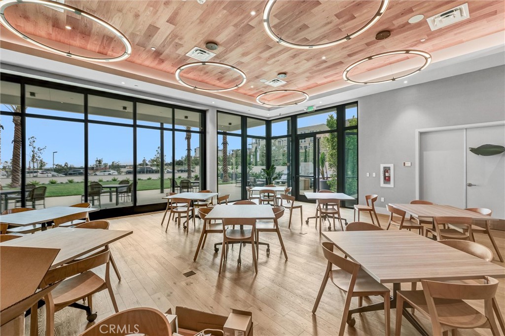 1808 Hollyleaf Terrace Montebello, CA 90640 - Photo 51 of 56 a view of a dining room with furniture large windows and wooden floor