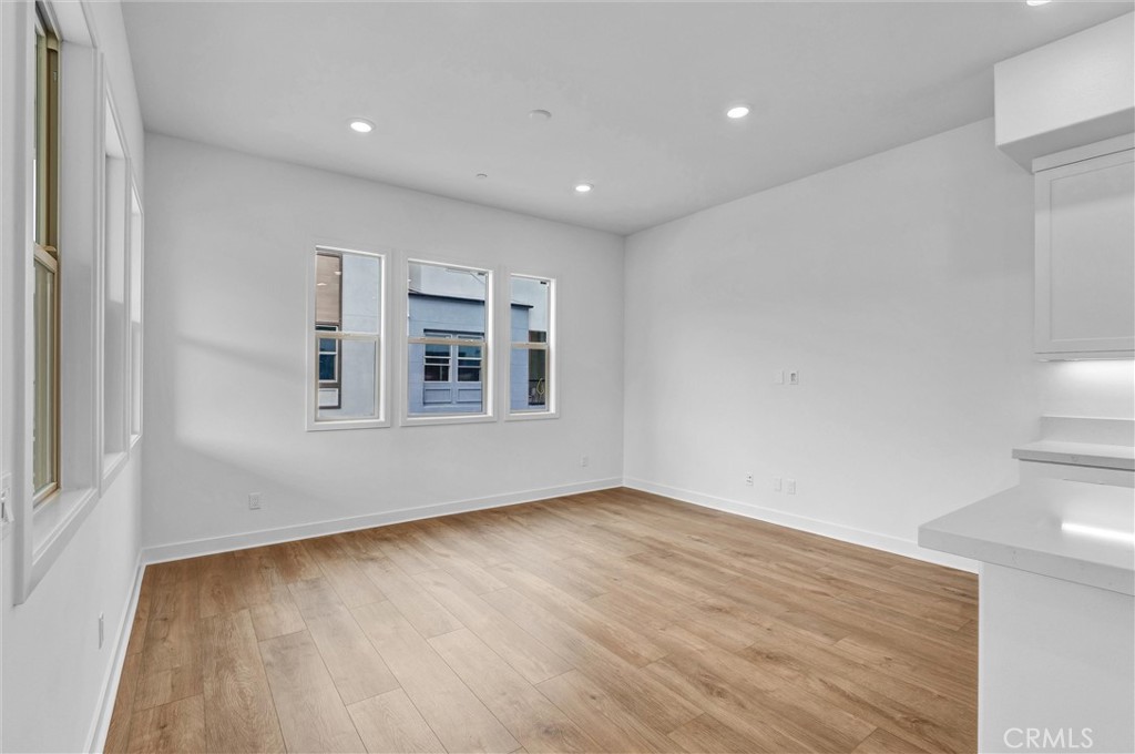 1808 Hollyleaf Terrace Montebello, CA 90640 - Photo 10 of 56 a view of empty room with wooden floor and fan