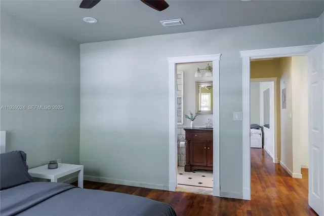 a hallway with a furniture and wooden floor