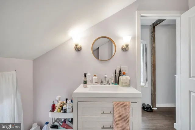 a bathroom with a sink and a mirror