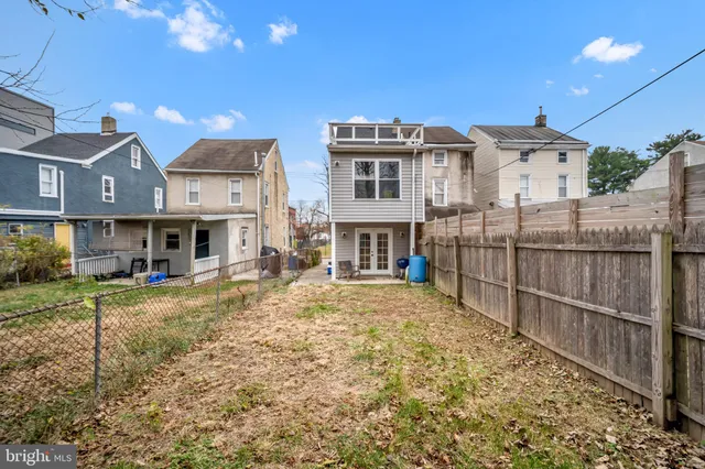 a view of a house with wooden floor and a fireplace