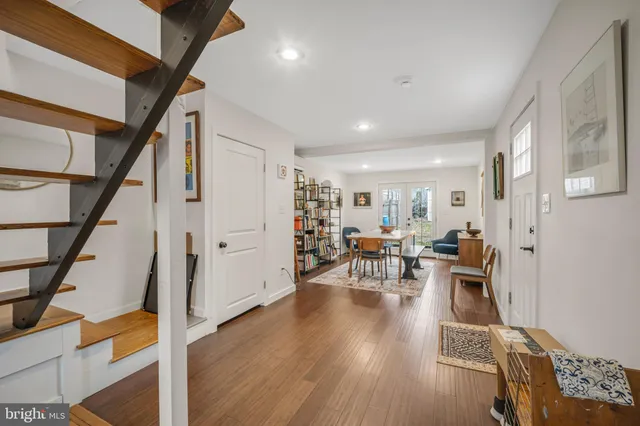 a view of a livingroom with furniture and hardwood floor
