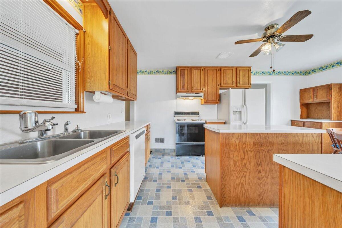 449 Cameron Drive Vinton, VA 24179 - Photo 13 of 39 a kitchen with stainless steel appliances a sink stove and refrigerator