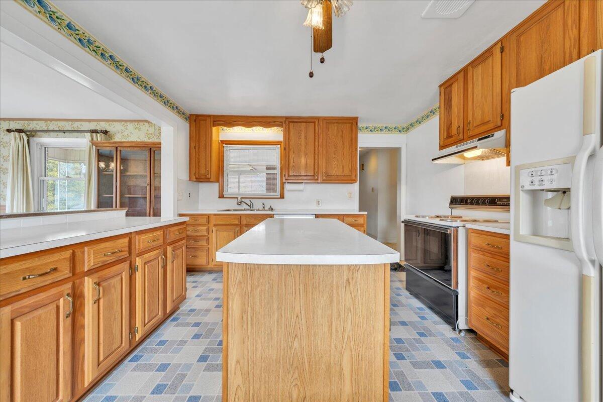 449 Cameron Drive Vinton, VA 24179 - Photo 16 of 39 a kitchen with stainless steel appliances granite countertop a sink and a stove