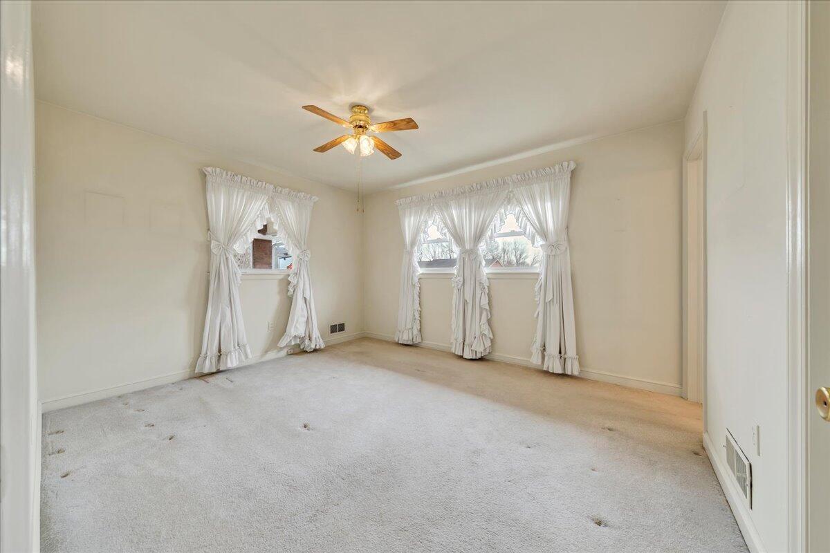 449 Cameron Drive Vinton, VA 24179 - Photo 17 of 39 an empty room with windows and fan