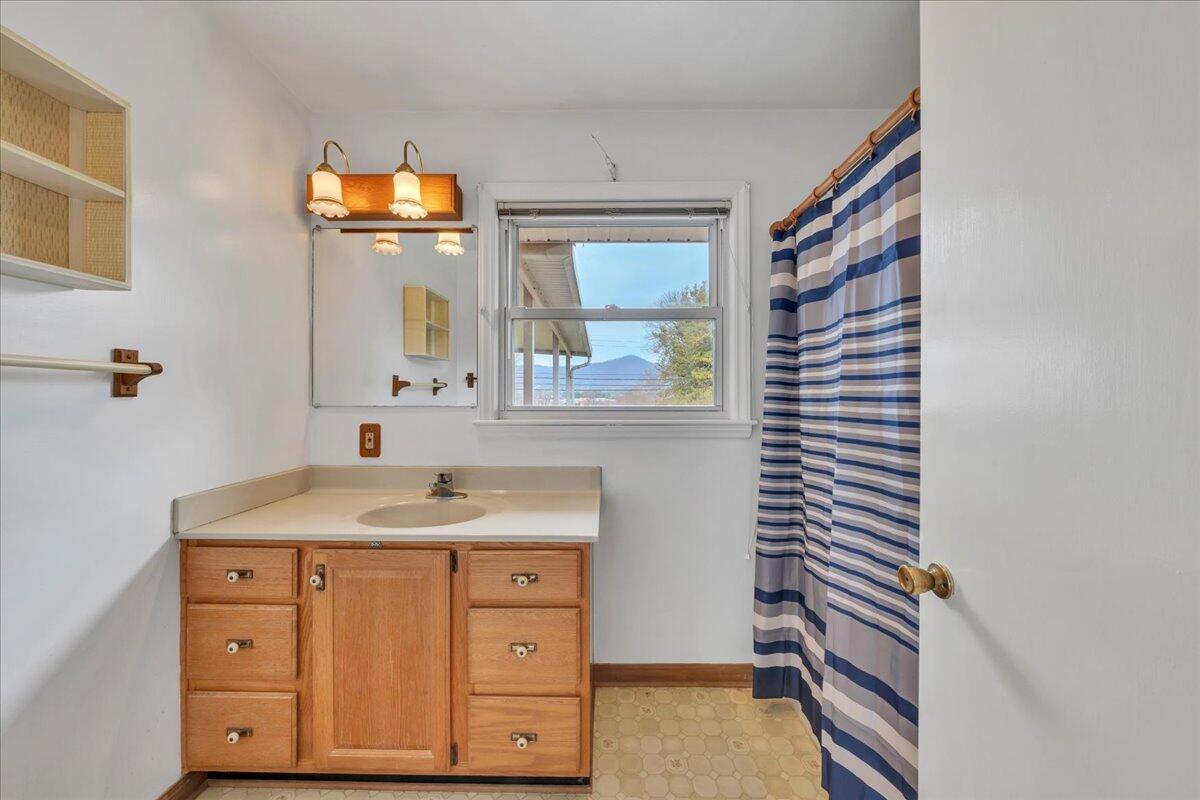 449 Cameron Drive Vinton, VA 24179 - Photo 23 of 39 a bathroom with a sink and a mirror