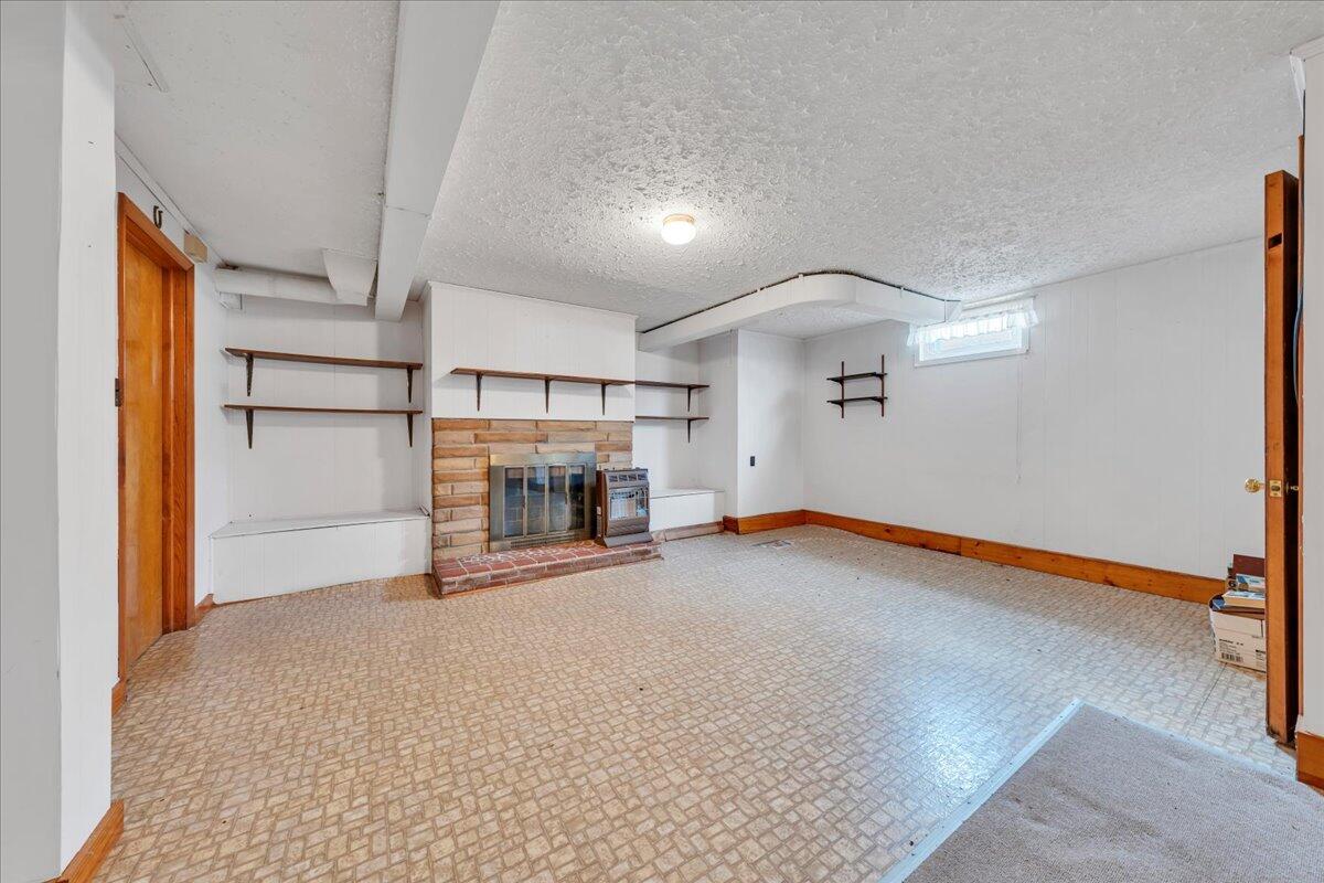 449 Cameron Drive Vinton, VA 24179 - Photo 27 of 39 a view of empty room with fireplace and ceiling fan