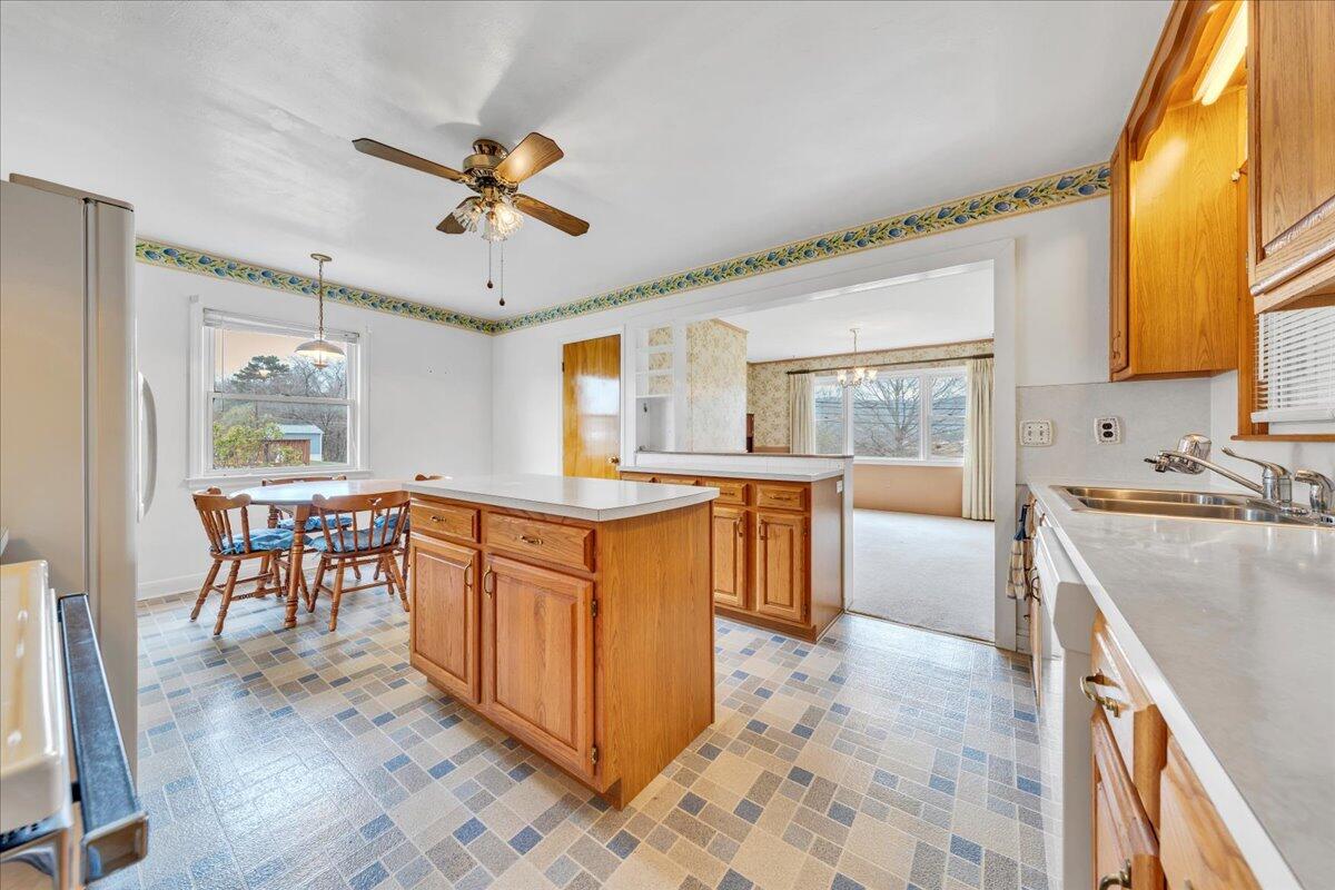 449 Cameron Drive Vinton, VA 24179 - Photo 10 of 39 a kitchen with stainless steel appliances granite countertop sink stove top oven and cabinets