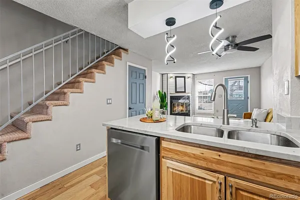 a kitchen with stainless steel appliances sink and cabinets