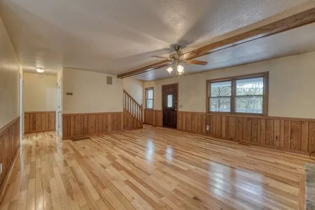 a kitchen with stainless steel appliances granite countertop a stove microwave and cabinets