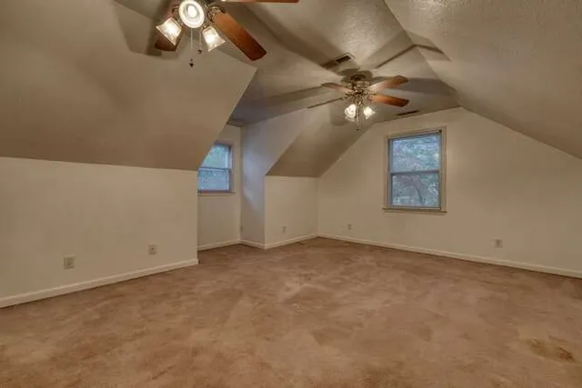a view of a porch with wooden floor