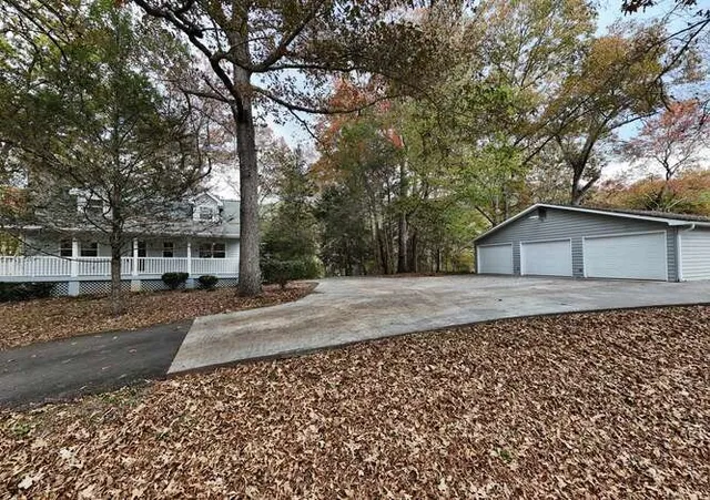 a view of a kitchen with a sink and a refrigerator