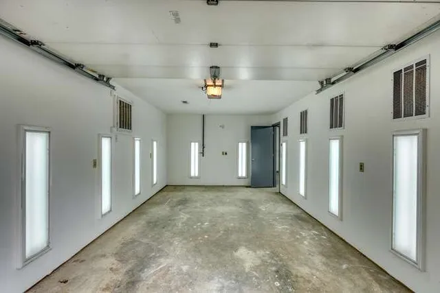 a view of a backyard with wooden fence