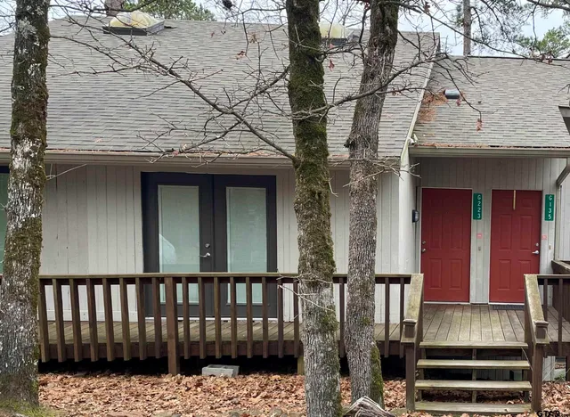 a front view of a house with a gate