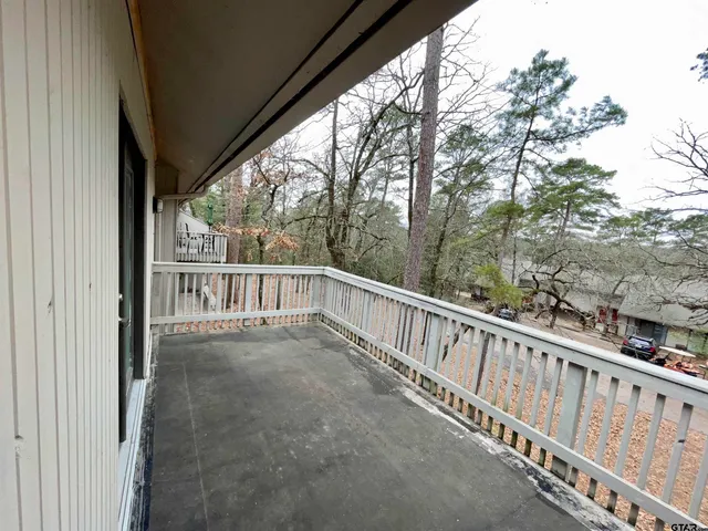 a view of a balcony with an outdoor space