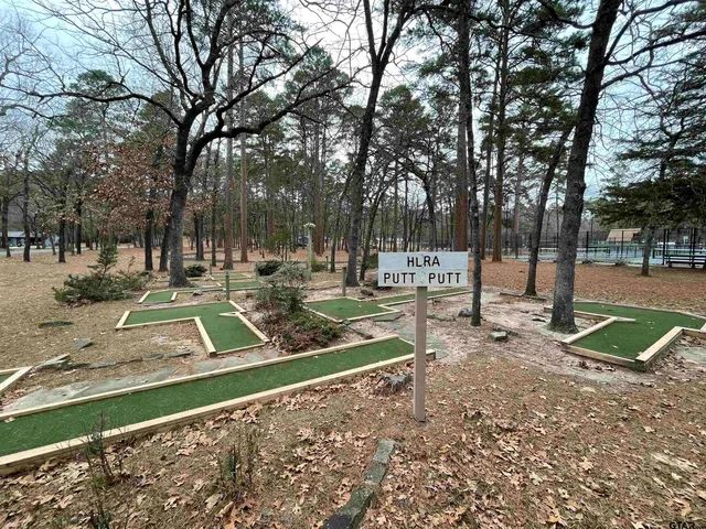 a view of a park with swings and slides
