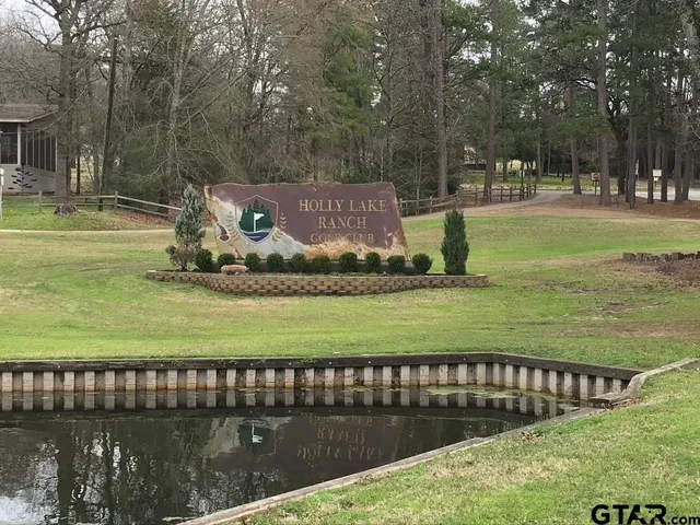 a view of a park with swings and a bench