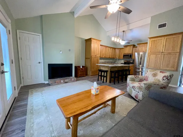 a view of a livingroom with furniture and a chandelier