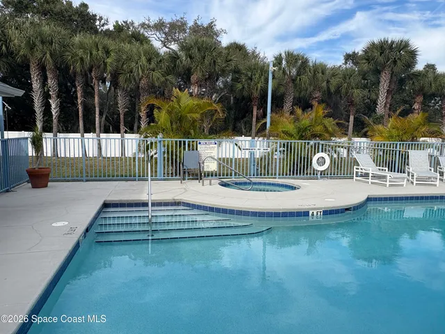 a view of swimming pool with a yard