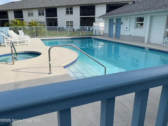 a view of swimming pool with outdoor seating