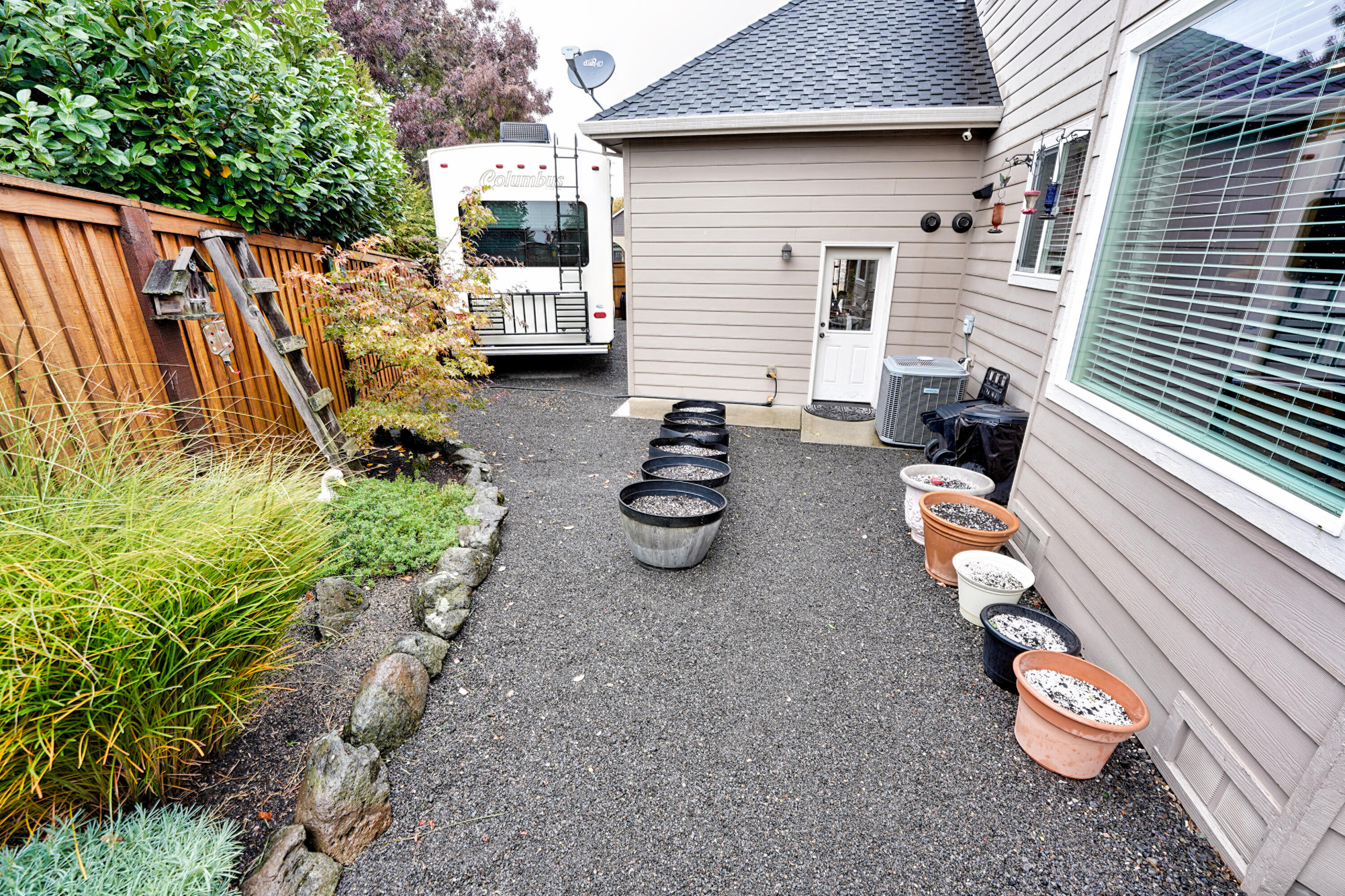 2154 Rabun Way Central Point, OR 97502 - Photo 24 of 39 a view of a patio with chair and tables back yard of the house