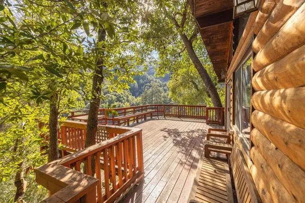 a view of a two chair and table in the balcony