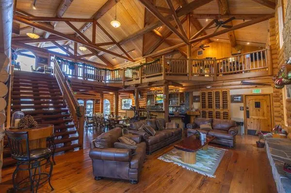 a view of a swimming pool with outdoor seating