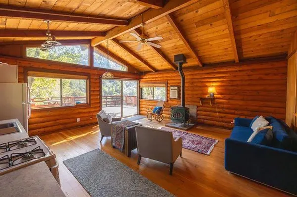 a bedroom with a bed next to a window