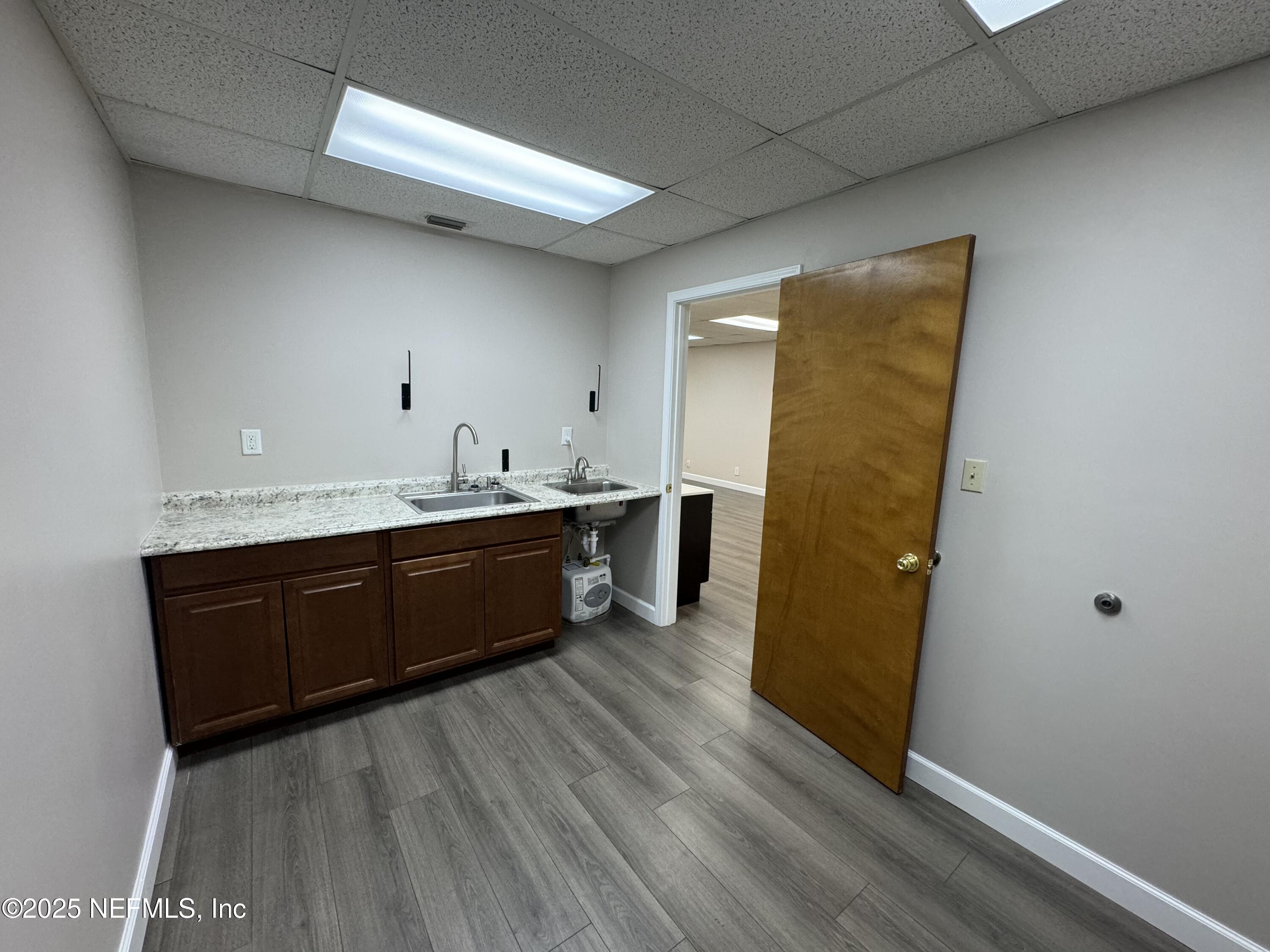 3938 Sunbeam Road Jacksonville, FL 32257 - Photo 13 of 28 a spacious bathroom with a double vanity sink and a mirror