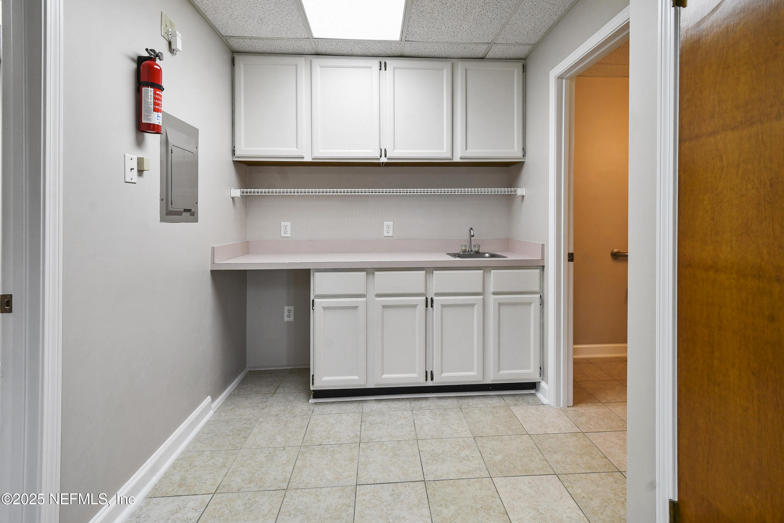 3938 Sunbeam Road Jacksonville, FL 32257 - Photo 7 of 28 a view of cabinets and window