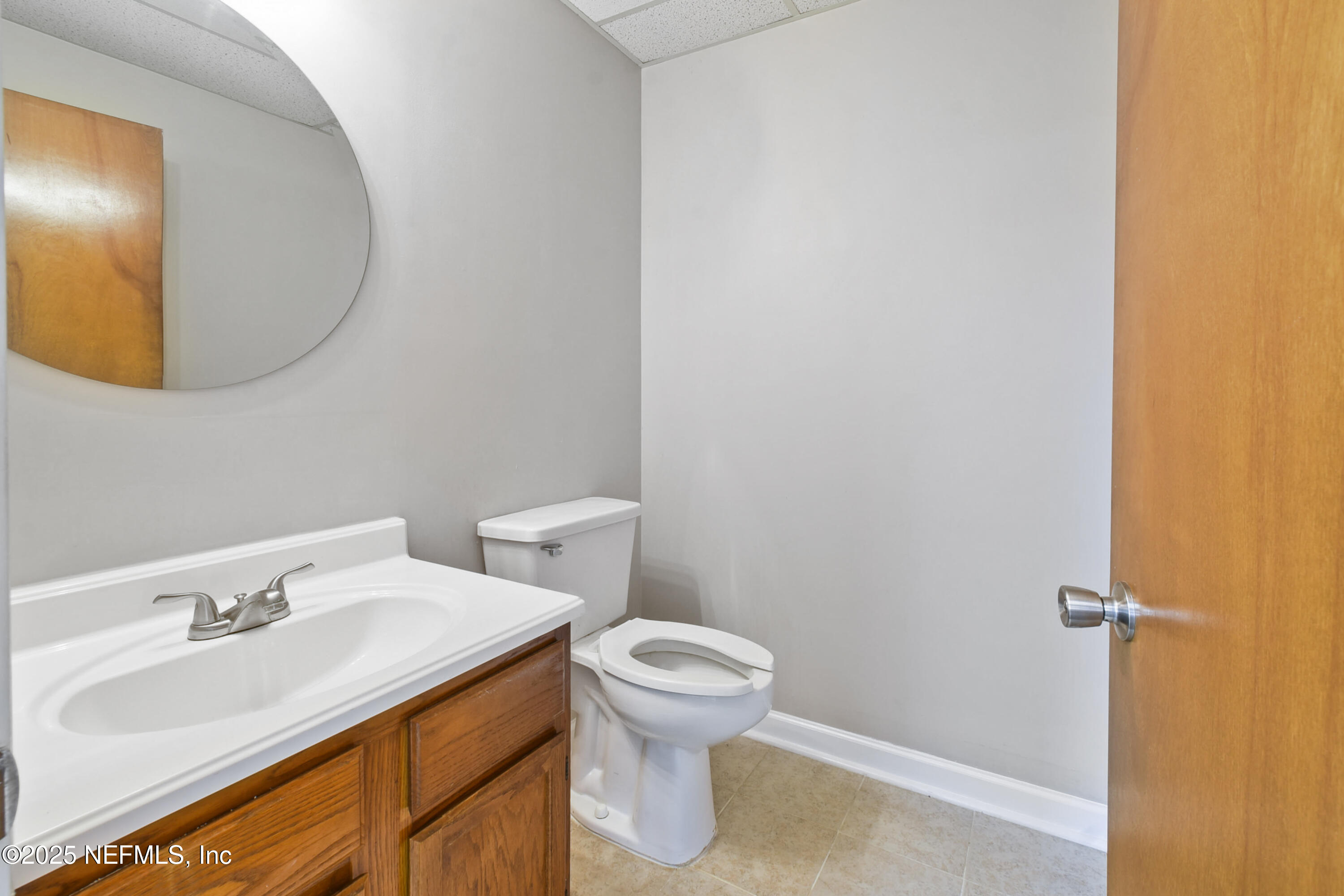 3938 Sunbeam Road Jacksonville, FL 32257 - Photo 9 of 28 a bathroom with a sink and a mirror