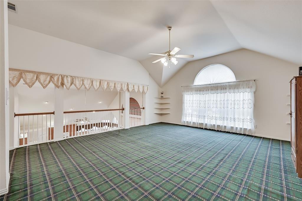 5701 Christy Lane Haltom City, TX 76137 - Photo 15 of 15 Empty room with a ceiling fan, carpet, and high vaulted ceiling