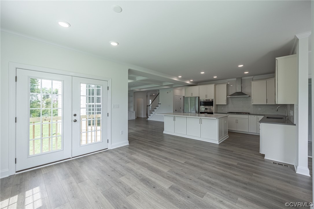 172 Blair Estates Richmond, VA 23222 - Photo 3 of 10 a open kitchen with white cabinets and wooden floor