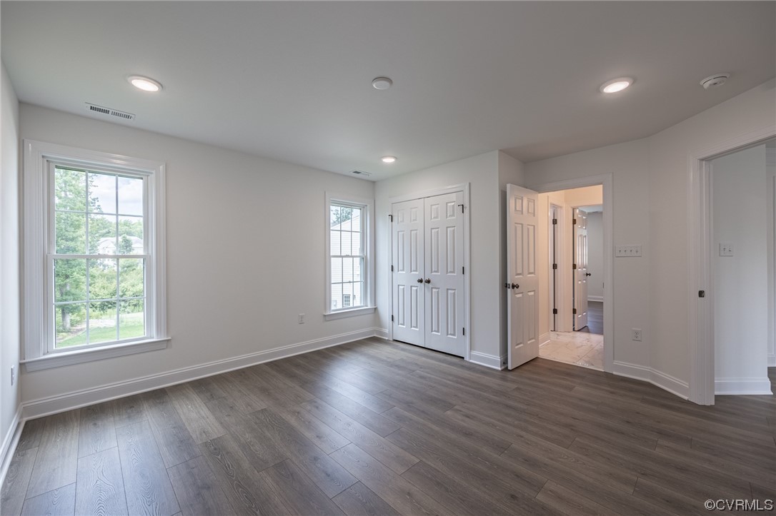172 Blair Estates Richmond, VA 23222 - Photo 7 of 10 a view of an empty room with wooden floor and a window