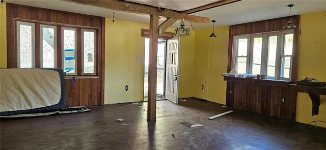 a view of a room with gym equipment and windows