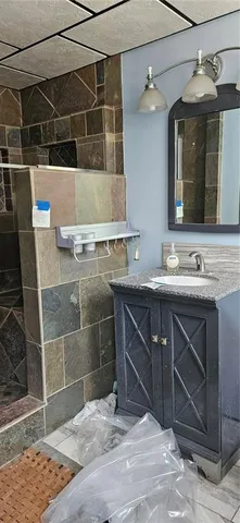 a bathroom with a sink and a mirror